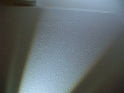 haut de porte d'entrée (en lumière rasante)