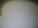 finition du galandage (coffre de fenêtre) gauche: bande calicot à reprendre et peinture (en lumière rasante)